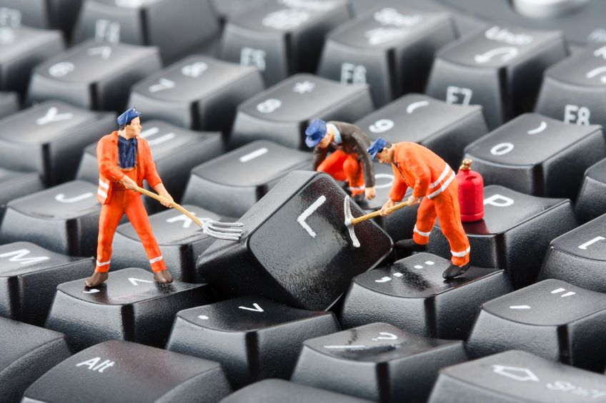 Tiny workers on a keyboard